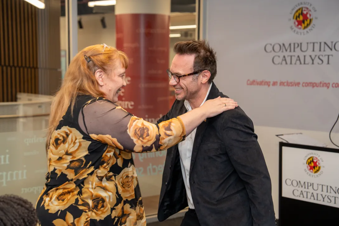 Jandelyn Plane reaches out to hug Brendan Iribe