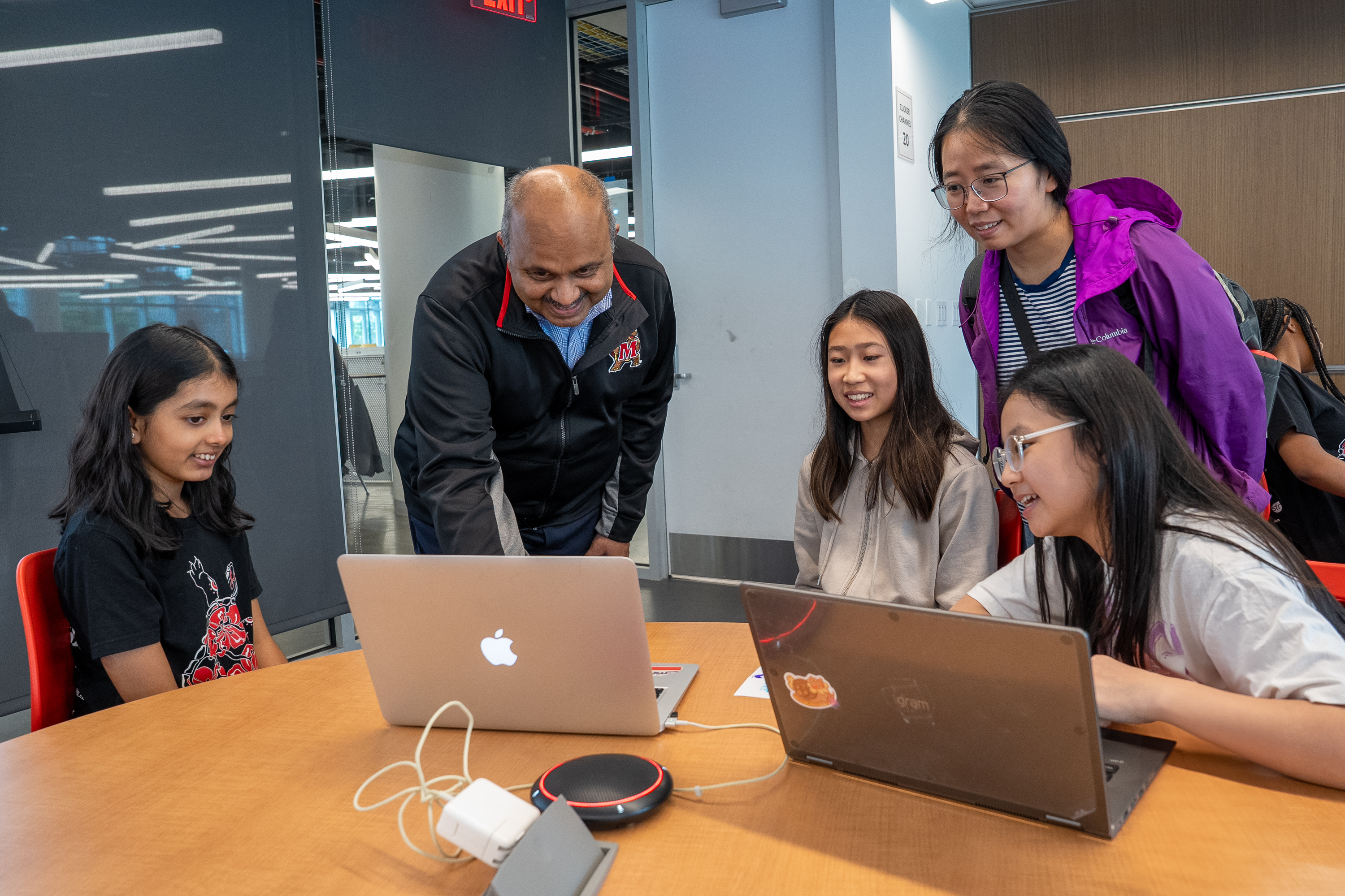 Dean Varshney looking at CompSciConnect student project at Maryland Day showcase