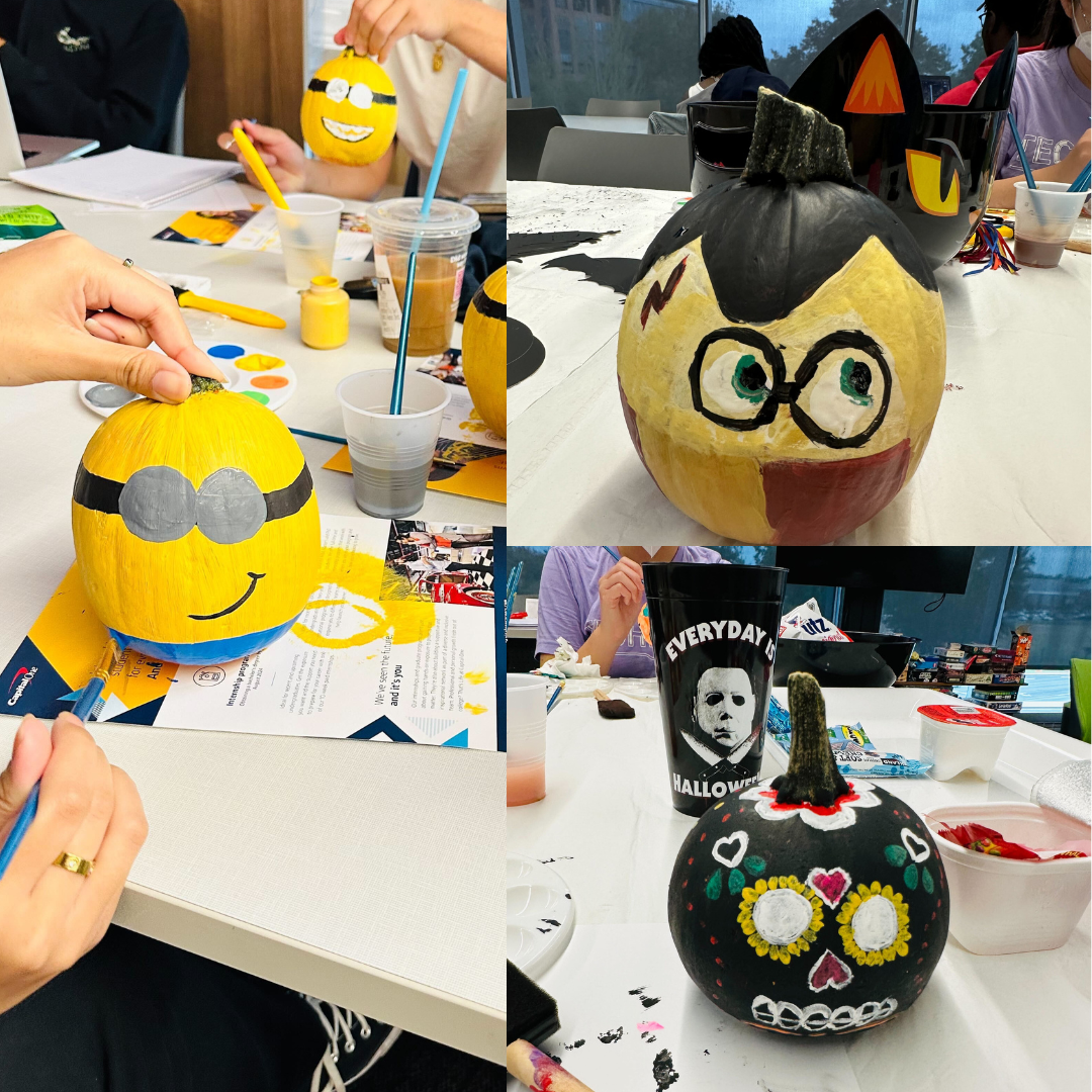 Painted pumpkins on a table.