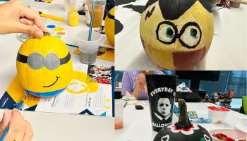 Painted pumpkins on a table.