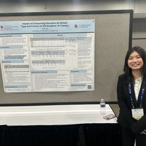 Ally Fu standing to the right of her research poster.