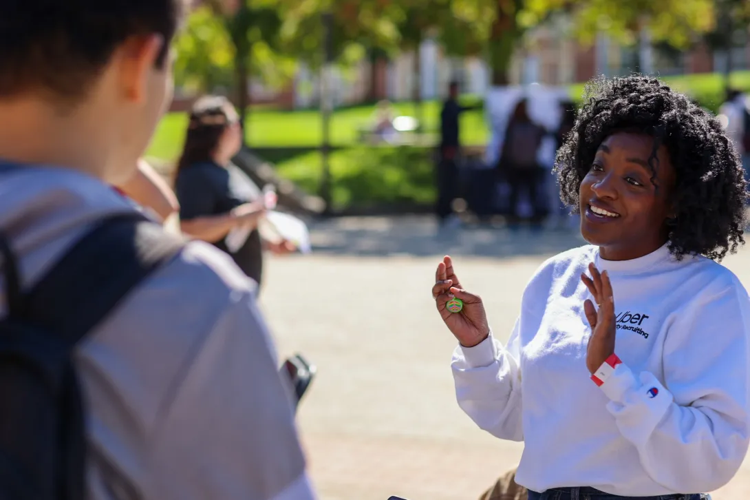 An Uber representative speaks with a student.