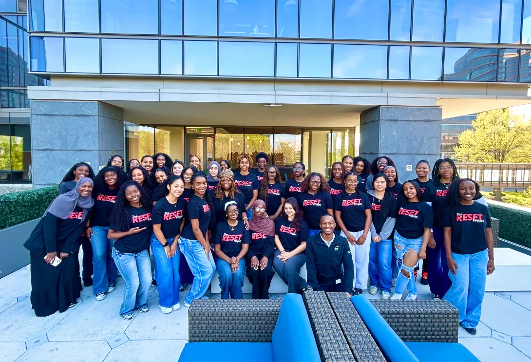 RESET Scholars pose outside the EY building